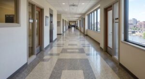 A VCT floor running down a commercial corridor in a Sioux Falls building